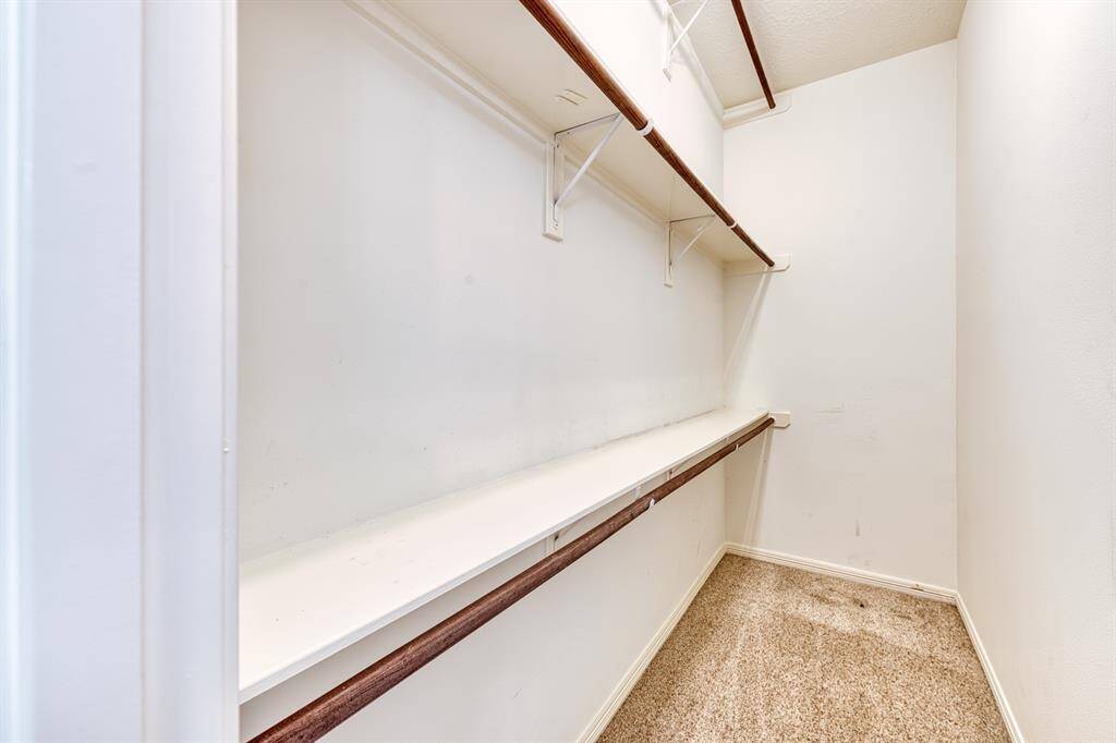 The second walk-in closet, again with ample hanging space.