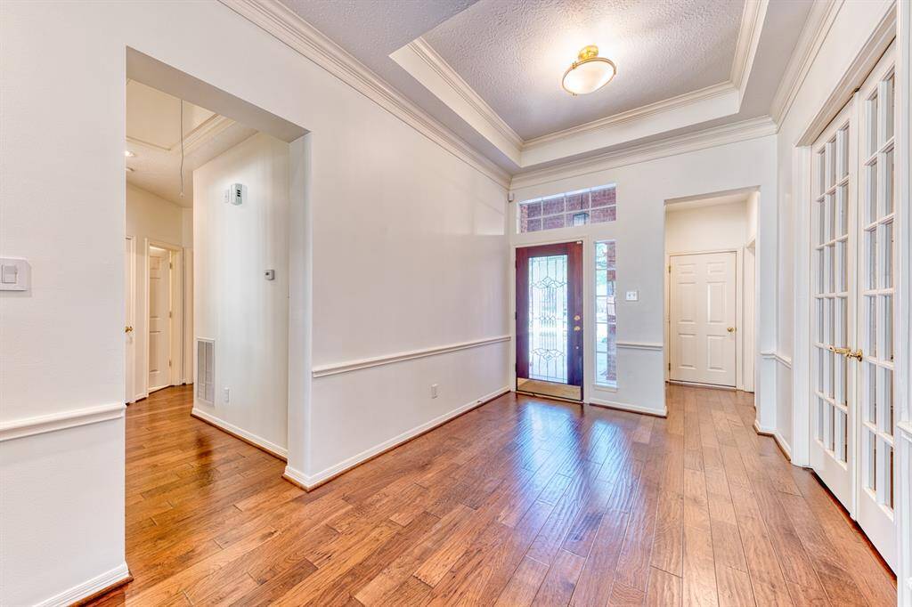 This home has the desired divided plan with the primary bedroom separated from the secondary bedrooms located  down this hall.
