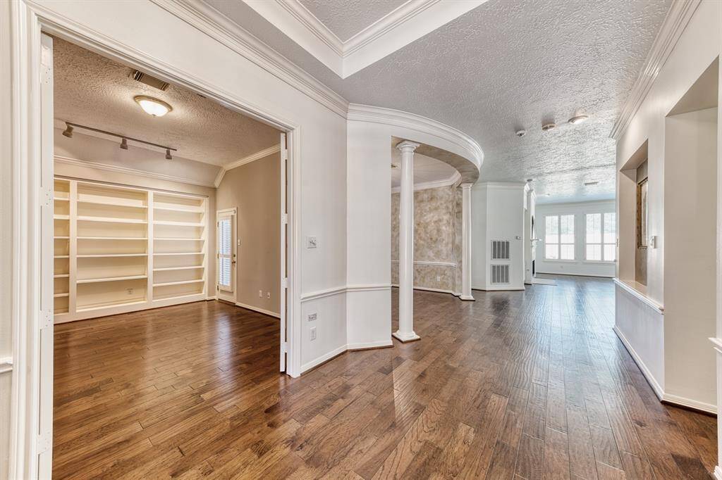 When you walk through the front door, you will notice the gorgeous wood floors, the beauty of the crown molding, the high ceilings and the very open floor plan!
