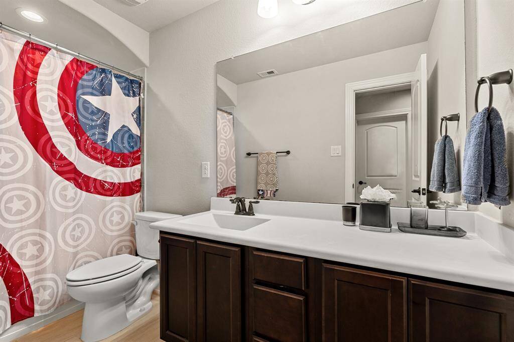 One of two secondary bathrooms located upstairs.