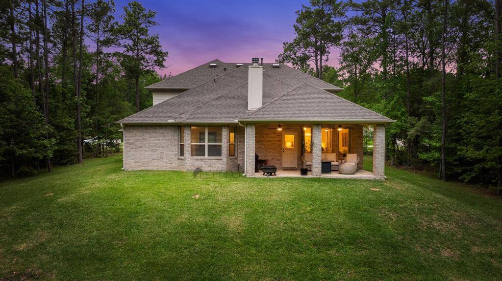 Enjoy outdoor gatherings on this spacious back porch. Plenty of room for your future pool.