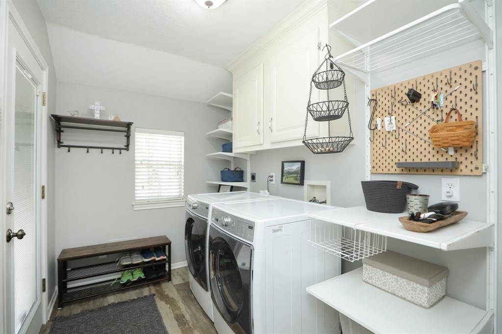 Very Large Laundry Room and WASHER AND DRYER STAY! Look at all the shelves and space!