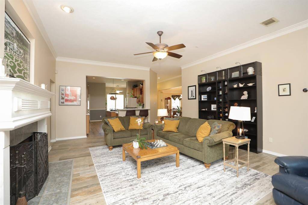 Another view looking toward the Kitchen. Enjoy a nice fire with a Gas Log Fire Place.