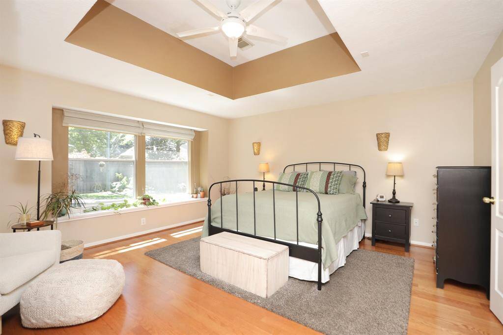 Awhh the Owner's Retreat. This room is so inviting with a Coffered Ceiling, wood floors and 2 large windows that look out to your awesome backyard!