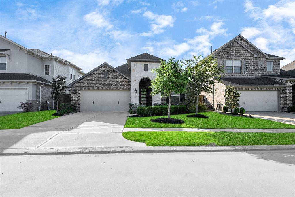 11714 Deepwater Ridge Way impeccably maintained with lush Bermuda grass and great curb appeal. A warm welcome starts right at the lawn.