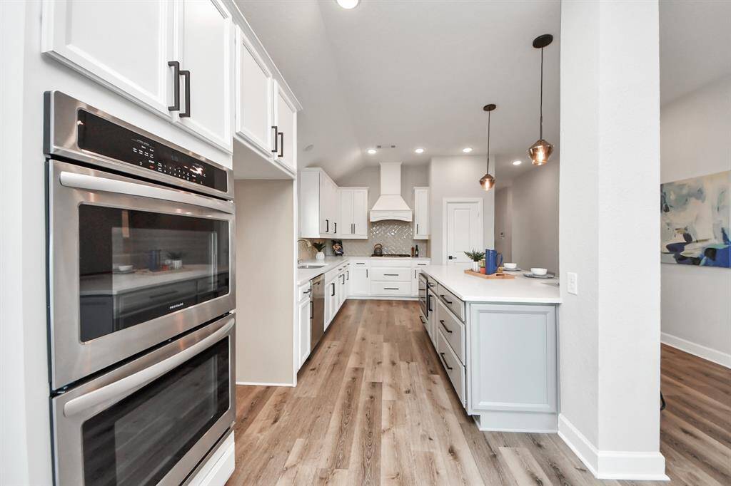 The flooring adds warmth, creating an inviting atmosphere.