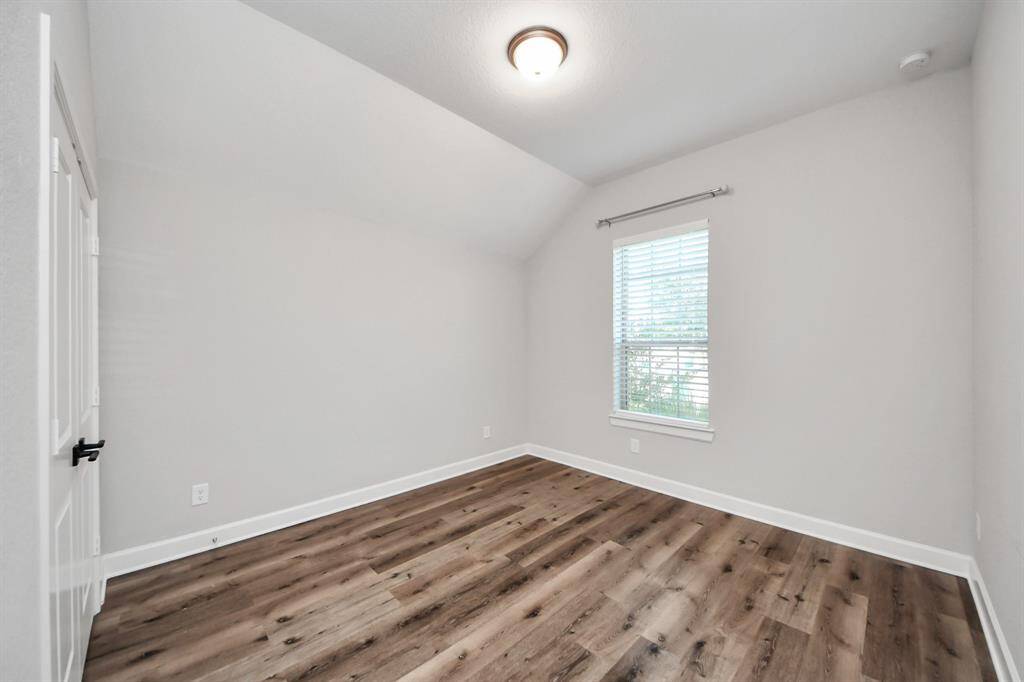 The third bedroom features sleek, carpet-free flooring—easy to maintain and perfect for a clean look.