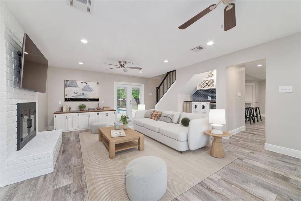 Expansive family room with a warm and inviting fireplace.