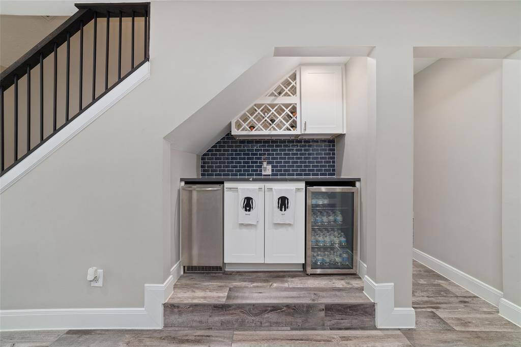 Sleek modern beverage bar with your own ice maker, fridge and wine rack