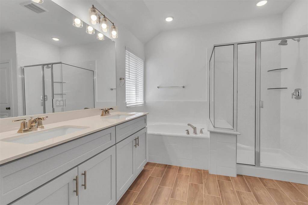 Main Bathroom with double sinks and Two separate walking Closets!