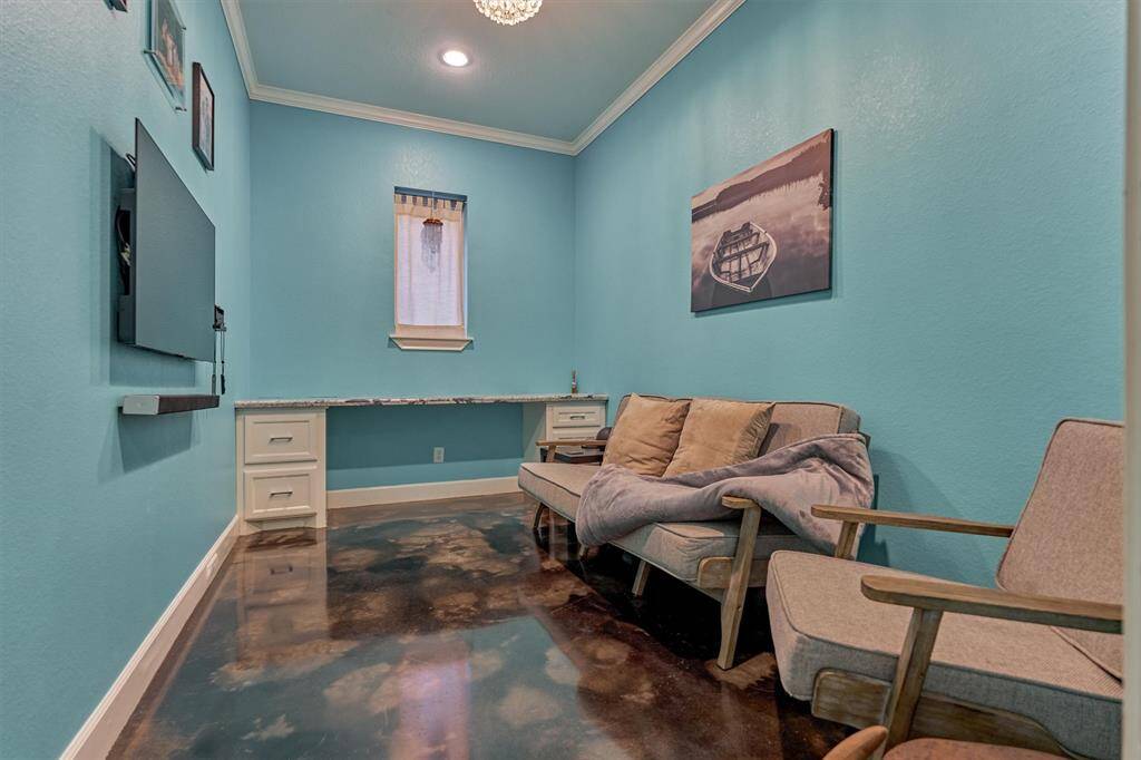 Tucked away just off the mudroom, this flexible space offers the perfect level of privacy—ideal for a home office, study area, or a dedicated gaming room for teens.
