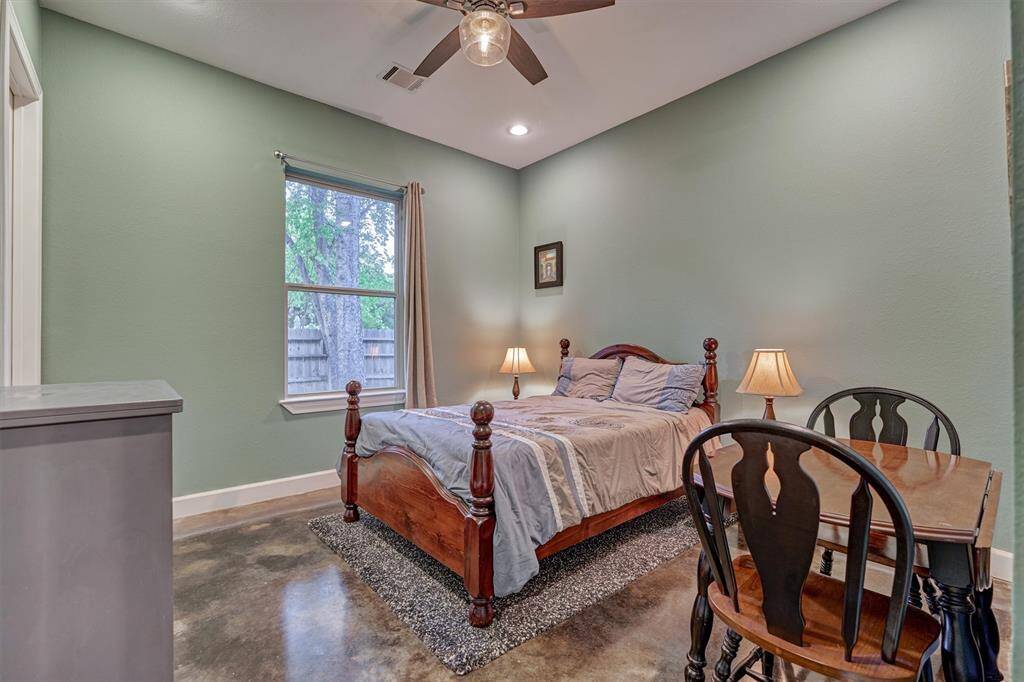 The second guest bedroom is generously sized and offers the comfort and privacy of its own en-suite bath—perfect for visiting family or long-term guests.