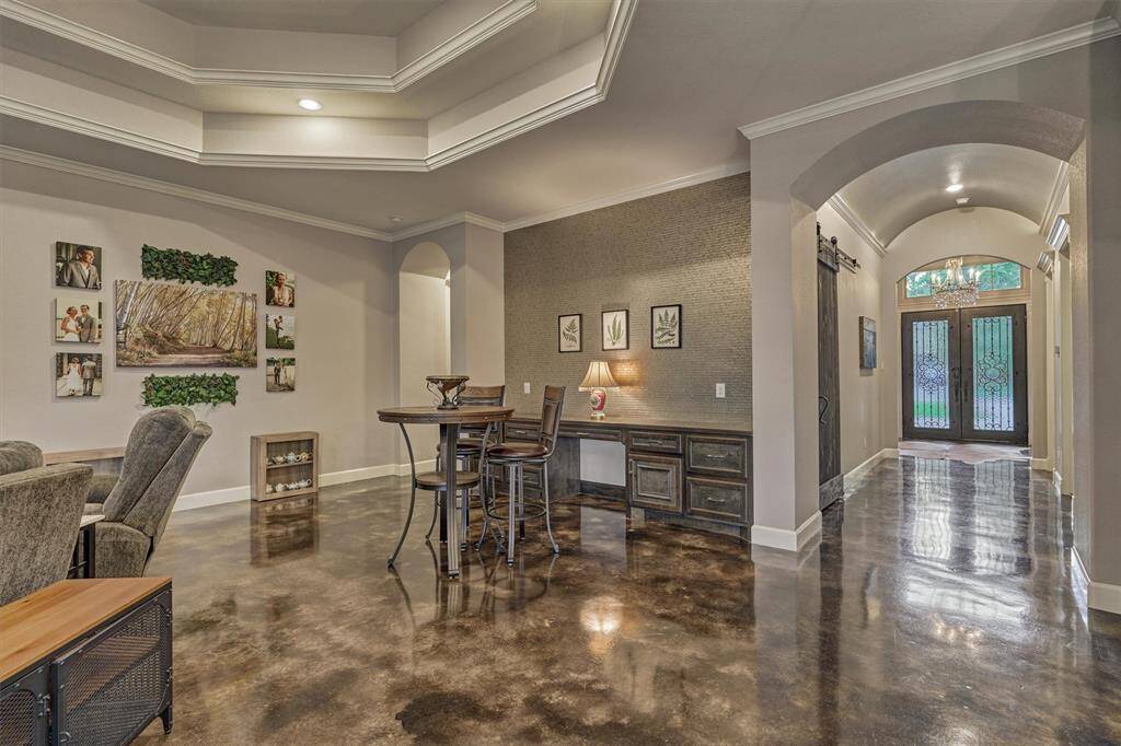 Just a few steps from the entry foyer, the dining area embraces an open-concept design, making it perfect for entertaining guests or enjoying quality time with family in a connected, welcoming space.