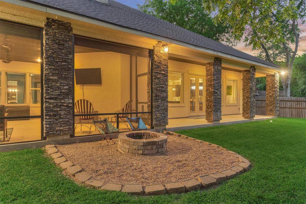 The cozy fire pit area offers the perfect spot to unwind on cooler evenings.