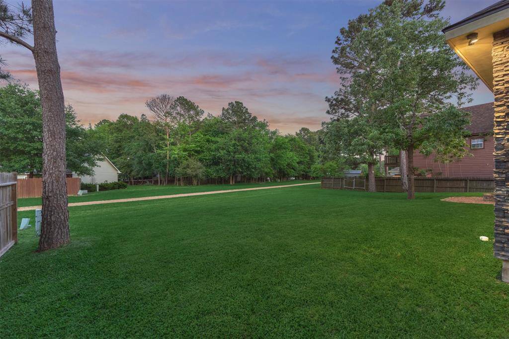 The spacious backyard offers the flexibility to be fenced in for added privacy or left open to fully enjoy the natural surroundings. With plenty of room for outdoor games, entertaining, or even adding a pool, this space is can be customized to suit your lifestyle.