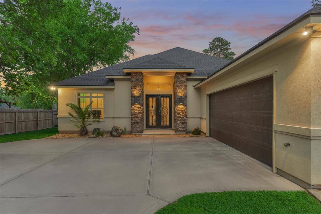 Accent lighting along the stonework and corners of the home enhances its architectural charm, creating a warm and inviting ambiance, especially in the evenings.