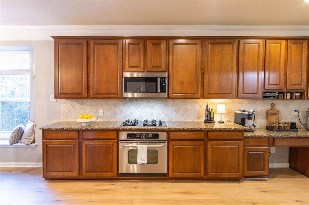 Convenient desk space and the lovely stain of the cabinets