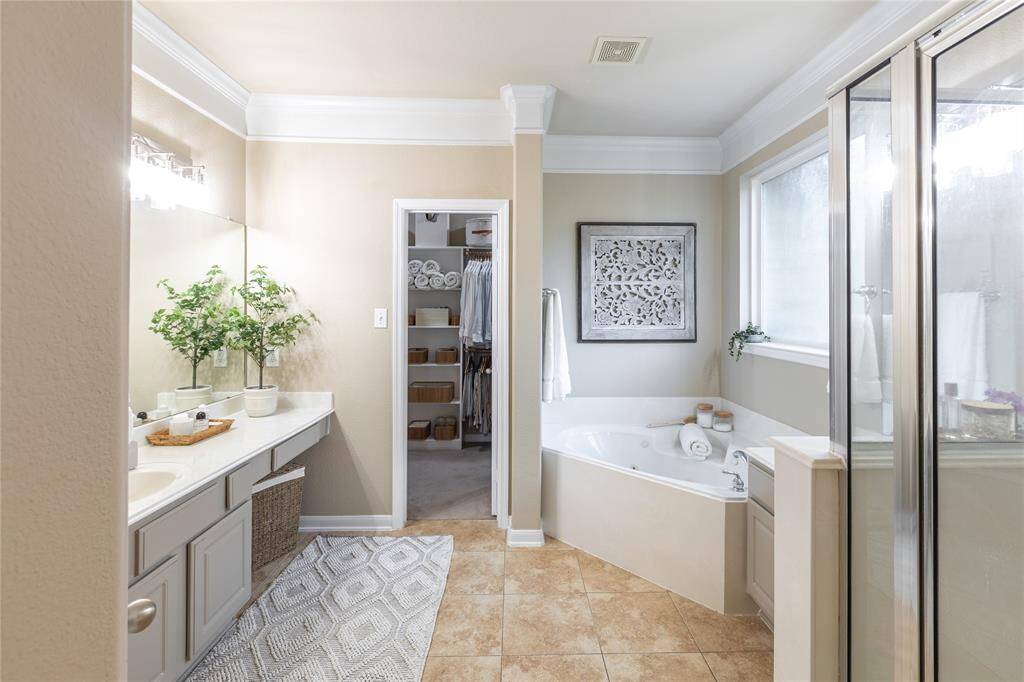 Primary ensuite with jetted tub and stand alone shower