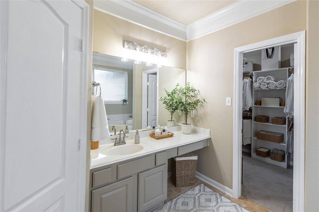 Sink and vanity area in primary ensuite