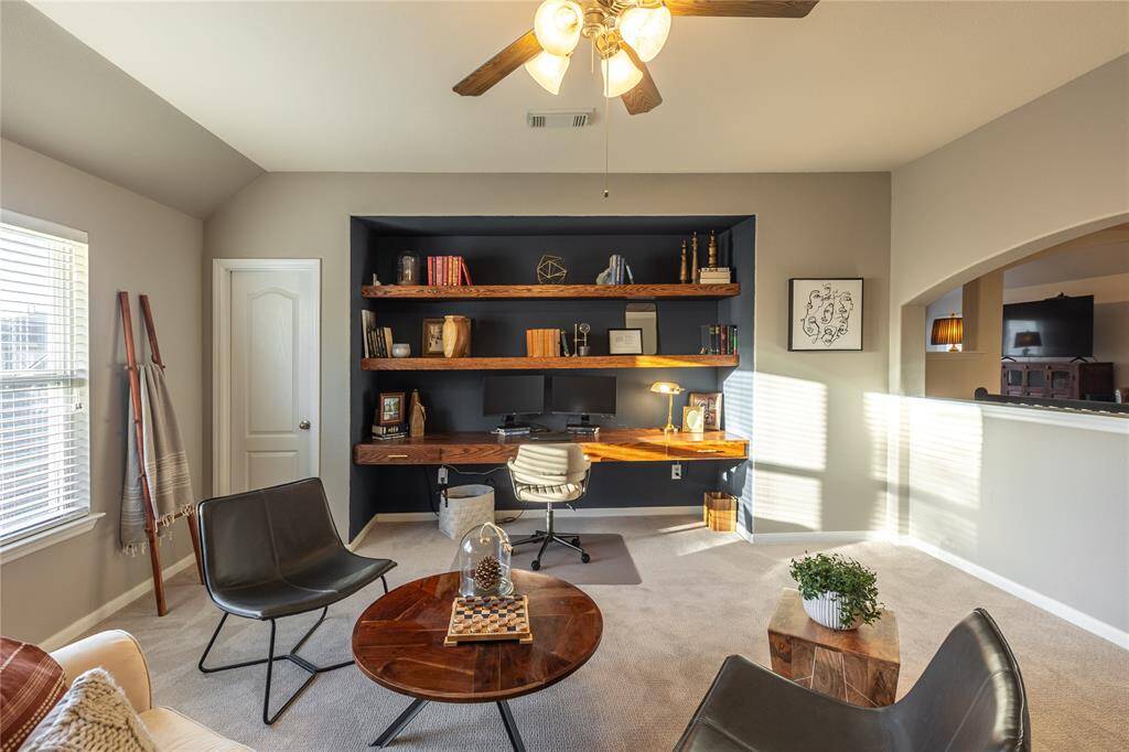 One of the two upstairs spaces outfitted with additional work station. Perfect for those working remote.