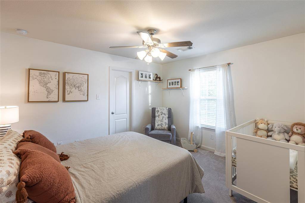 One of three secondary bedrooms on second floor