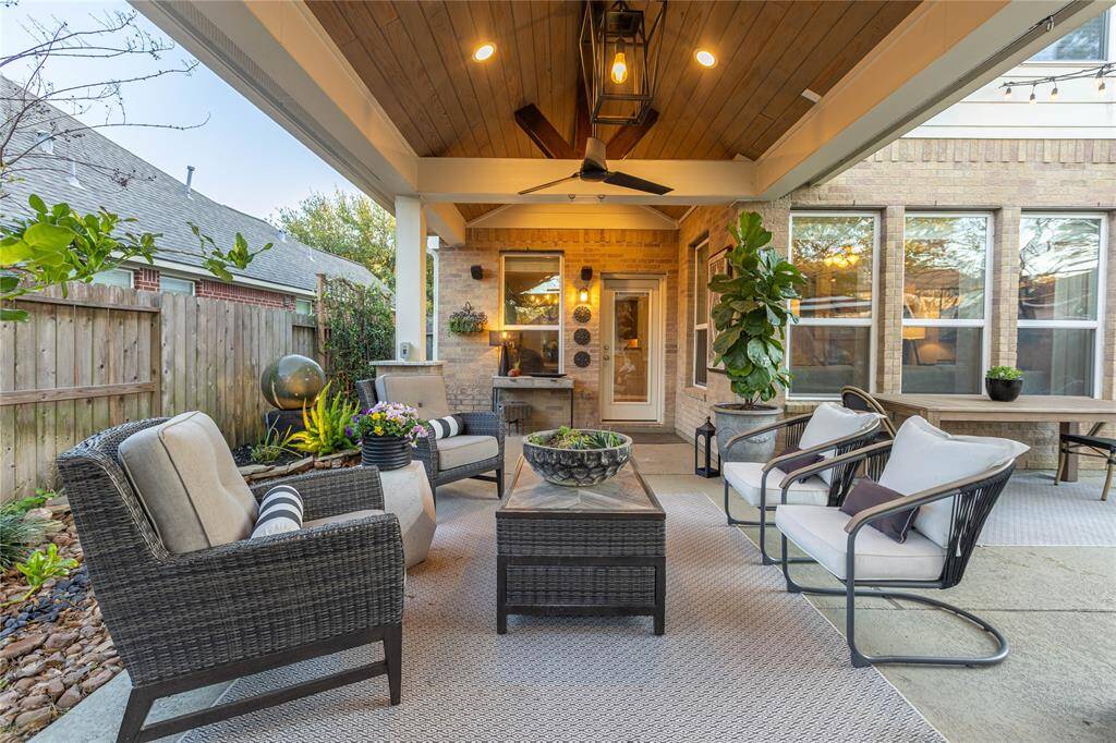 Enjoy the view of the outdoor oasis from the outdoor living room