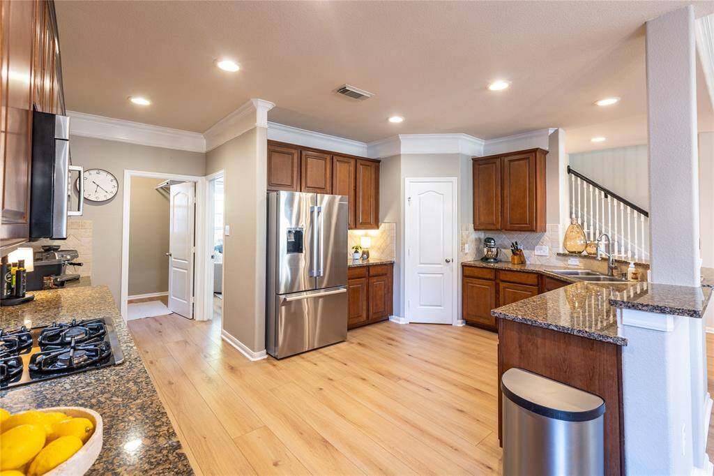 Large kitchen with ample cabinet space for storage and outfitted with high end appliances