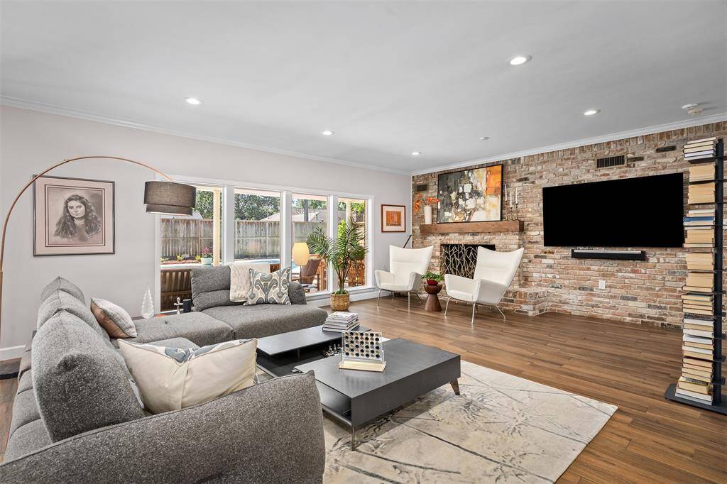 Expansive family room with views of the covered patio, pool and yard.
