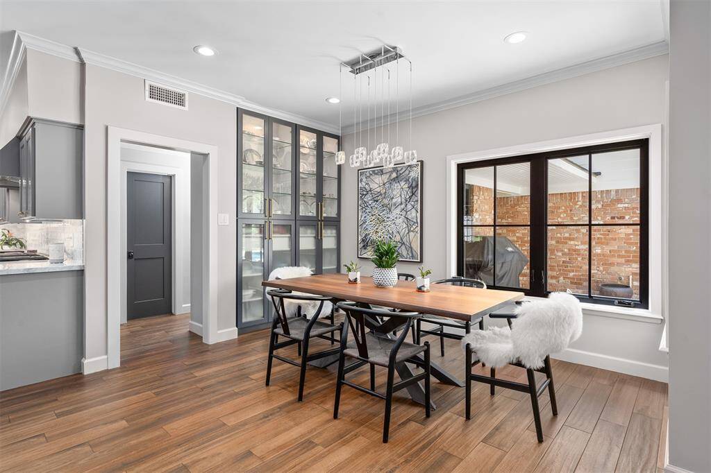 Light and bright breakfast roomn with custom-built cabinets. This home has wonderful storage!