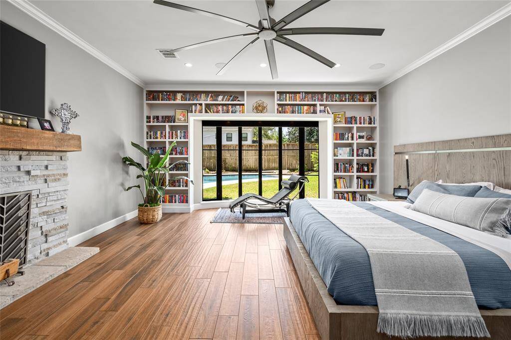 Floor to ceiling windows offer views of the backyard.