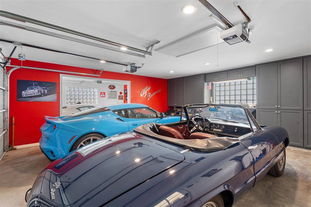 Immaculate 3-car garage. Wall of cabinets, glass brick windows offers great natural light. A/C unit keeps the garage comfortable on  summer days.  Full pool bath with shower is through the back.