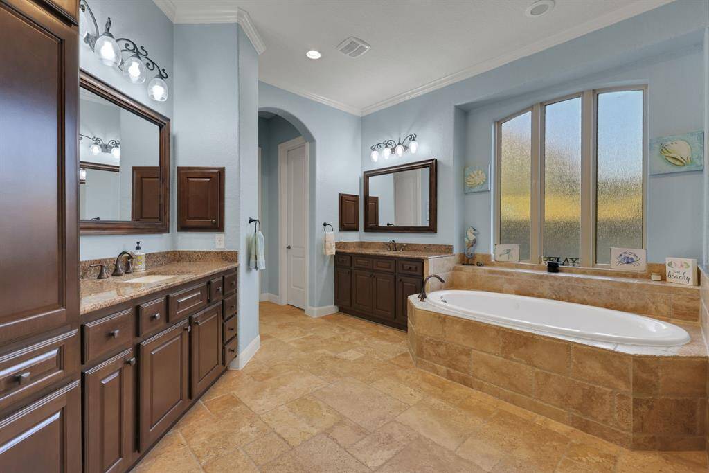 Primary bathroom with two walk in closets