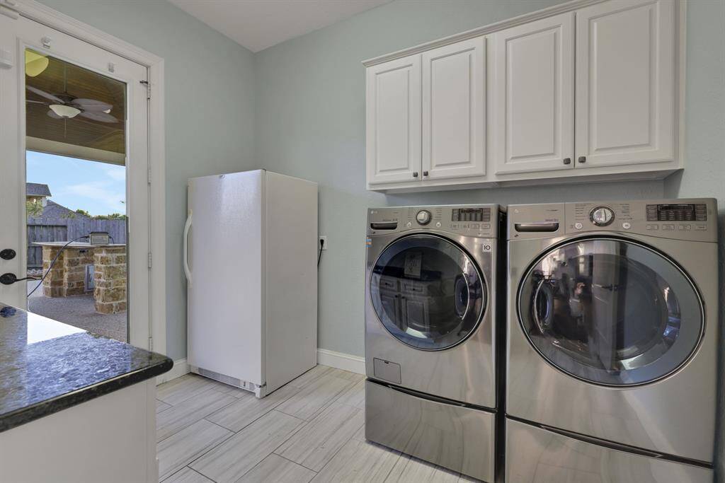 Laundry room with exit to pool/outdoor kitchen