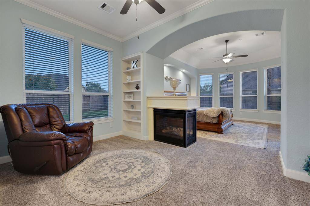 Primary seating area with two sided fireplace
