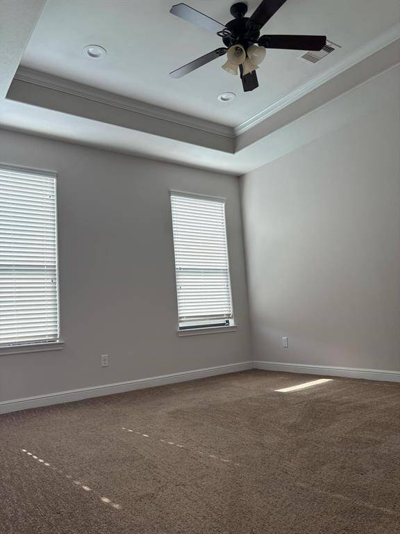 View of High Tray Ceilings in this Spacious Primary/Master Bedroom