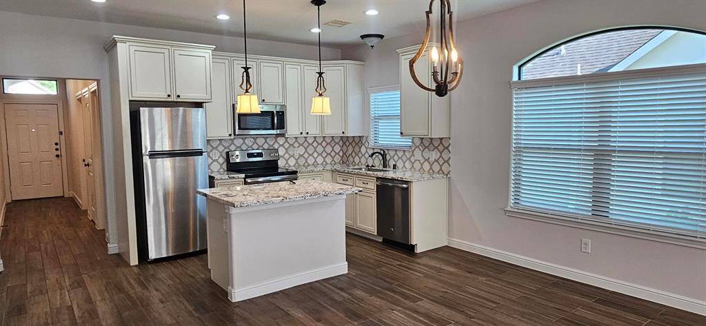 GE Oven/Cooktop, Microwave and Dishwasher. Whirlpool Refrigerator with ice maker included. Moen Faucets.