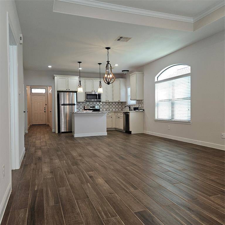 View of Open Kitchen/Dining From Back of Family Room