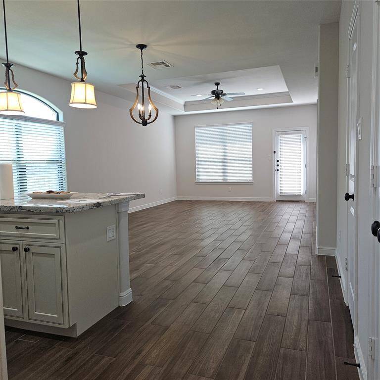 The majority of the flooring is tile with the wood floor look.  bedrooms are carpeted