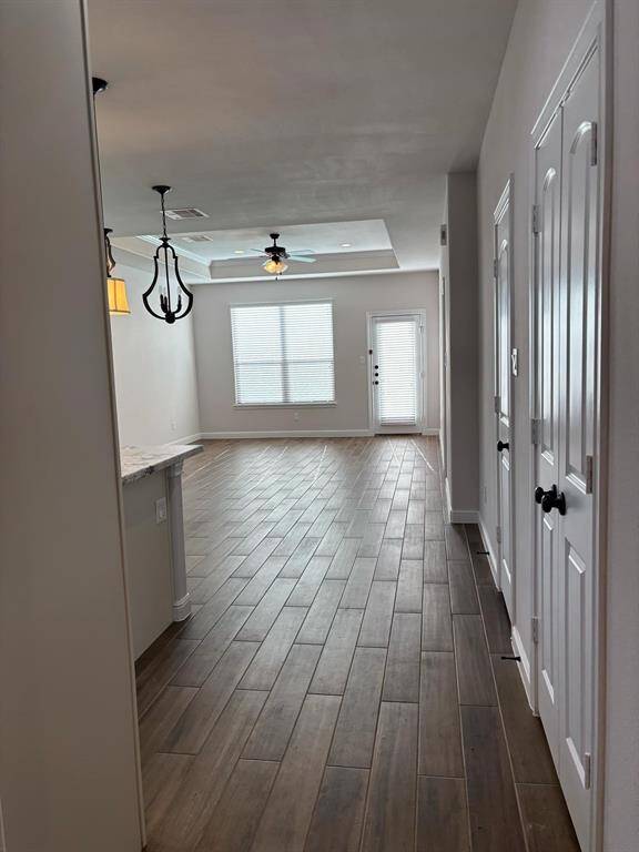 Glimpse of the Light and Bright Family Room from Entry