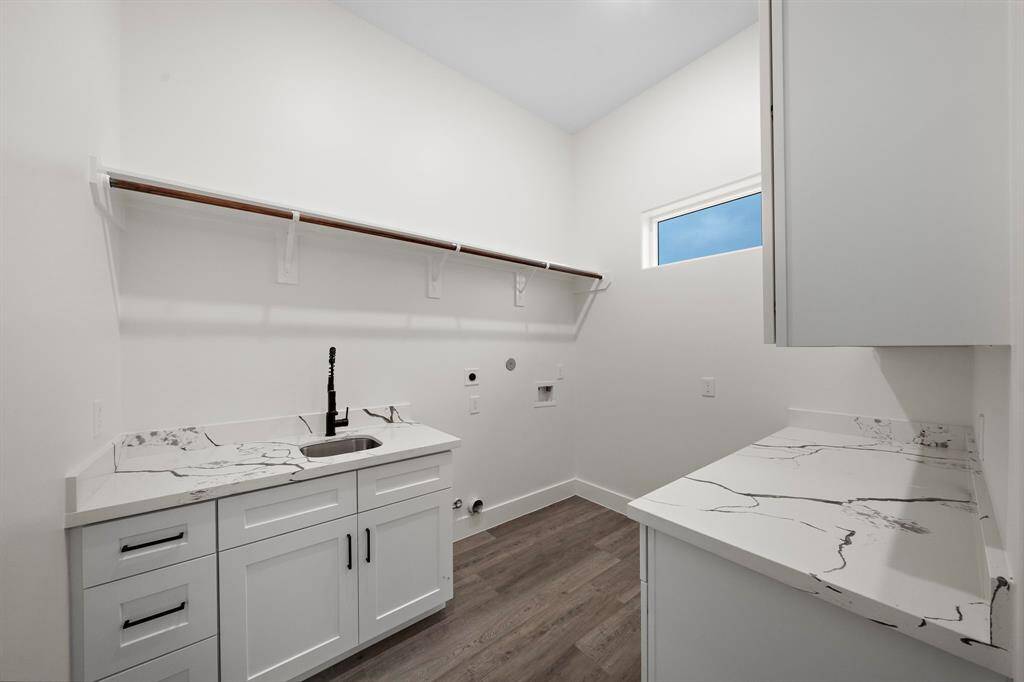 Bright and inviting laundry room with ample natural light.