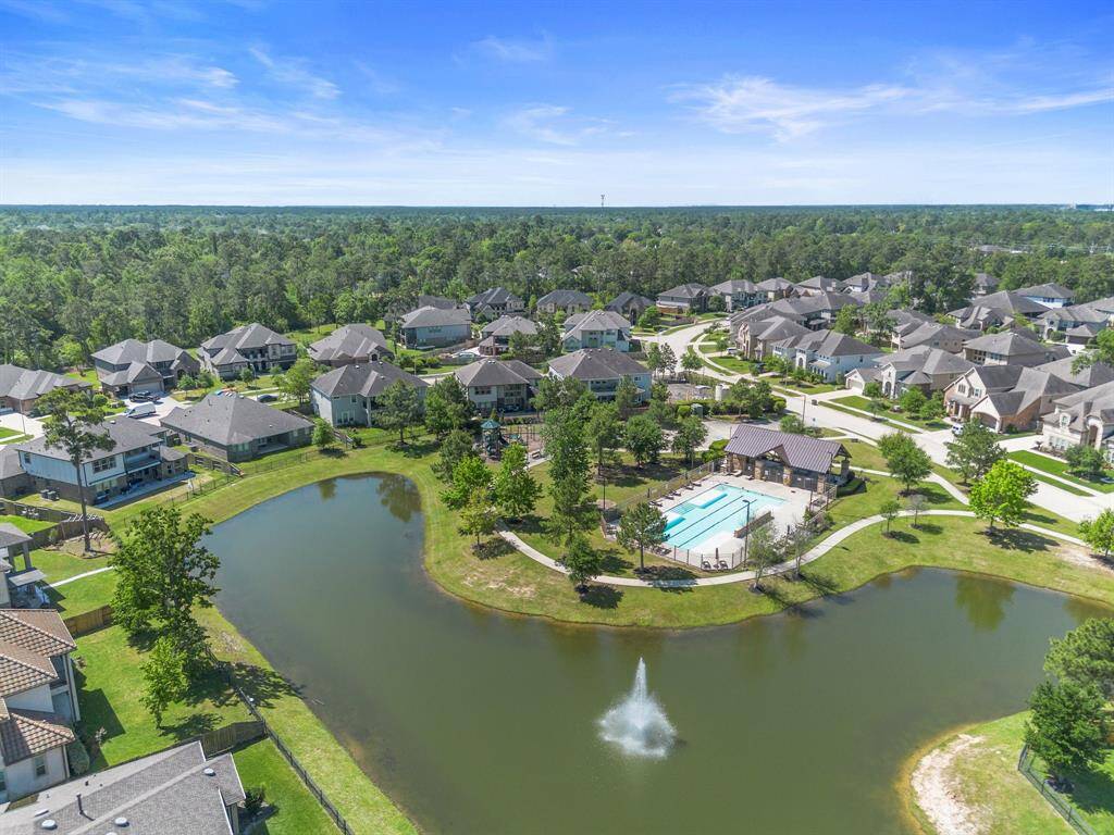 Enjoy access to resort-style amenities including a sparkling pool, pavilion, and peaceful walking paths surrounding a picturesque lake.