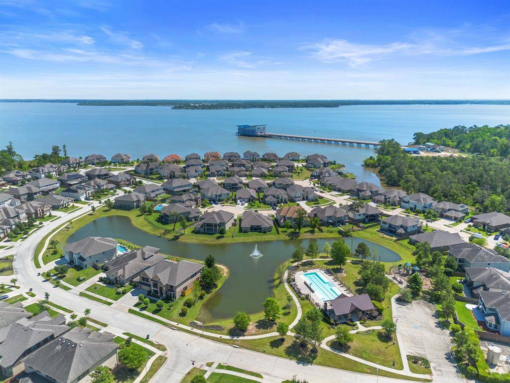 Enjoy life near the lake—this aerial highlights the community’s close proximity to the waterfront and showcases top-tier amenities like the pool and clubhouse.