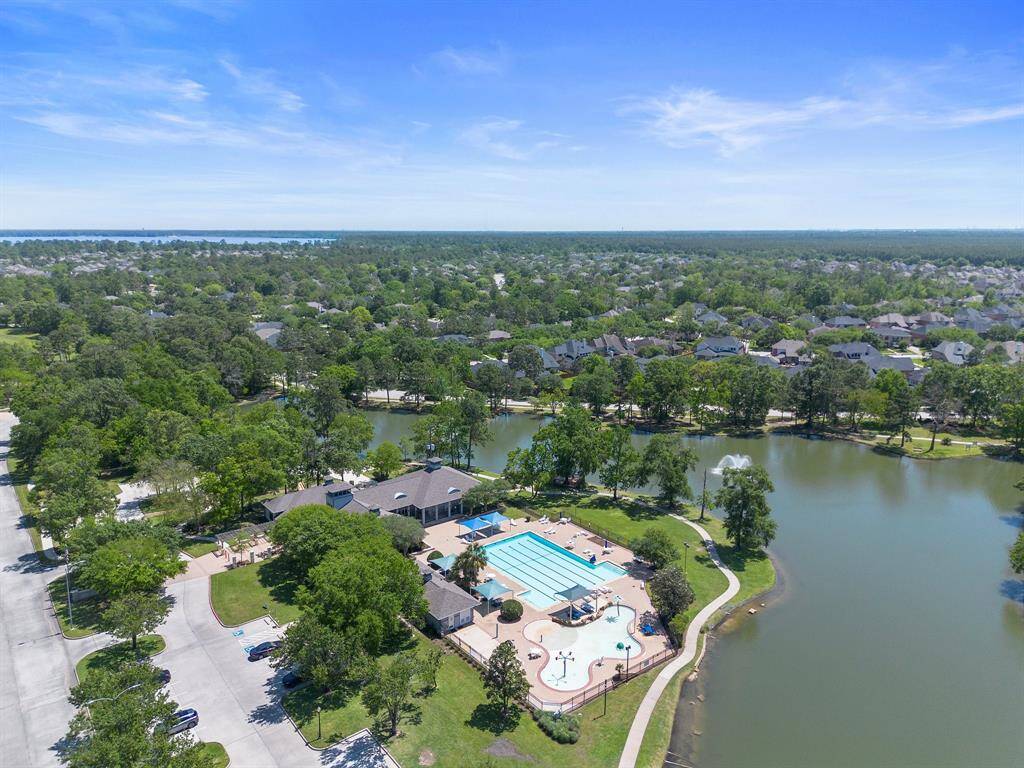 Resort-style amenities await with a large pool, splash pad, and gathering pavilion—all nestled beside scenic walking trails and a tranquil lake.