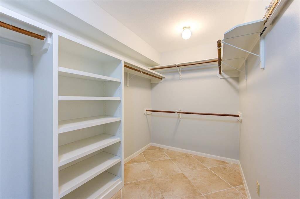 Primary bedroom has nice large walk-in closet with built-ins