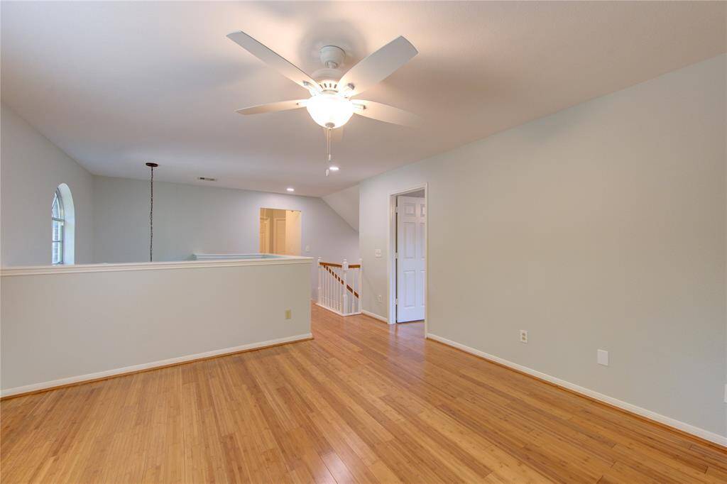 Gameroom located above stairwell at front of home.