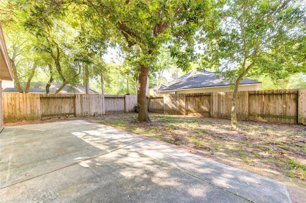 Shady backyard with extended patio. Ready for entertaining.