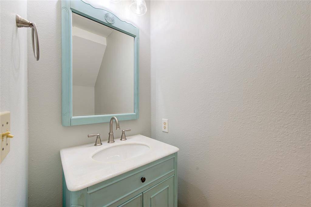 Half bath at bottom of stairway and under the stairwell