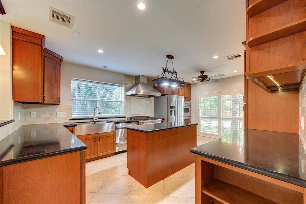 Light and bright island kitchen with upgraded appliances