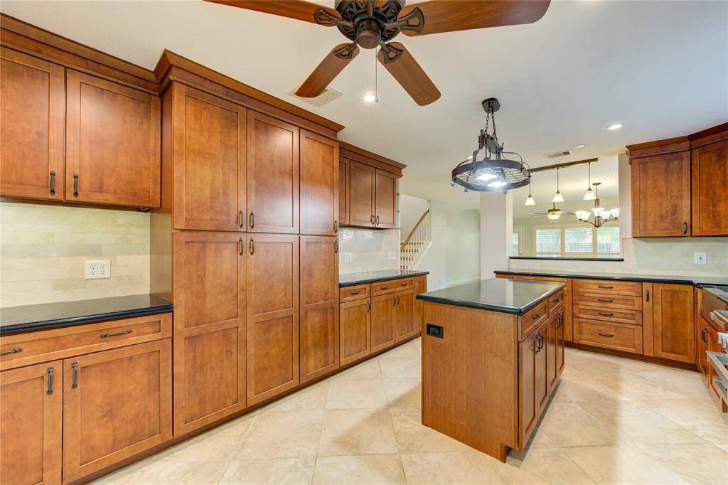 No lack of cabinet, cupboard, or counter space in this kitchen.