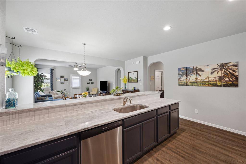 Full-length granite countertop and Breakfast Bar - perfect for serving a large gathering!